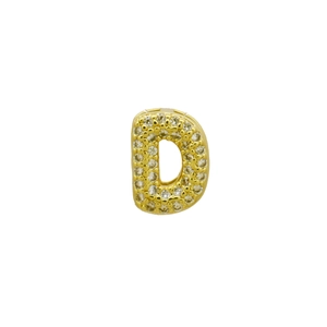 Close-up of golden bubble letter D pendant necklace featuring shimmering pavé cubic zirconia
