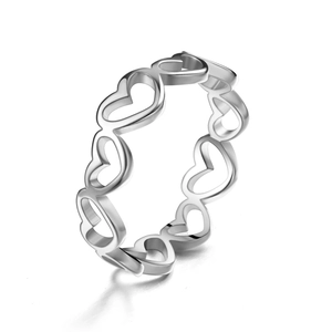 Close-up of polished silver steel ring featuring a continuous hollow heart pattern design