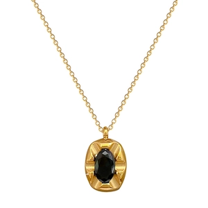 Gold titanium steel necklace featuring a minimalist oval black gemstone pendant on white