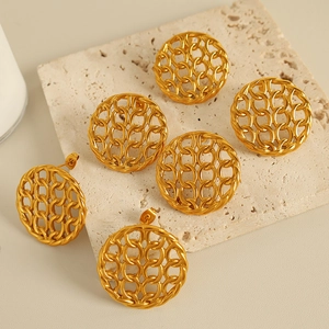 Chic vintage hollow mesh round stud earrings in gold finish on stone display