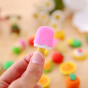 Creative pink ice cream shaped eraser held in hand, cute cartoon school stationery for kids