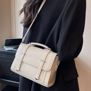 Chic beige PU leather messenger bag with silver buckles and top handle for women