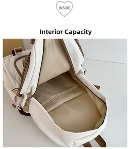 Detailed interior view of a white canvas school backpack showing large storage capacity