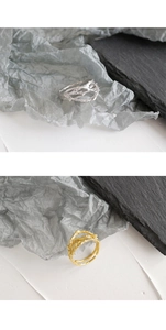 Detailed close-up of S925 silver thorn rings in silver and gold branch designs