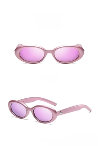 Detailed views of pink metal oval sunglasses with star accents and purple lenses