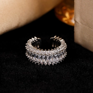 Detailed view of silver heart ring with rectangular cubic zirconia and pavé accents