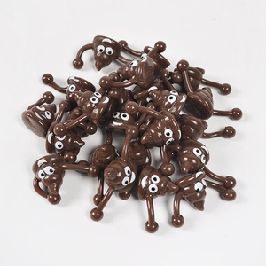Funny brown emoji poop slingshot toy made of smooth resin with cartoon facial features