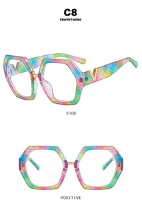 Close-up of rainbow glitter hexagonal frames featuring metal V hardware detail