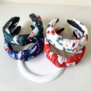 Set of four Christmas knot headbands featuring festive Santa and snowflake prints