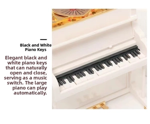 Detailed close-up of piano music box keys featuring high-gloss finish and golden mechanics