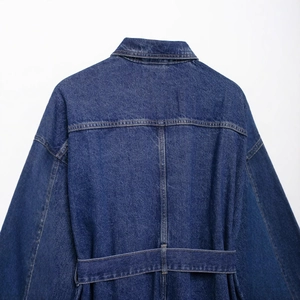 Rear view of vintage dark blue denim jacket featuring a waist belt and lapel design