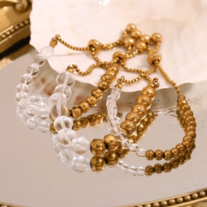 Detailed view of 18K gold plated beaded drawstring bracelets with acrylic beads