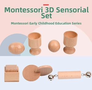Close-up of Montessori wooden sensory toys set including rattle ball and egg cup for babies
