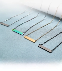 Detail view of 35mm long bar necklaces in silver, gold, black, and rainbow steel