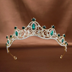 Vintage gold bridal crown with emerald green crystals and sparkling white rhinestones