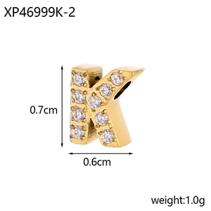 Detail of gold letter K micro-pave zircon pendant showing 0.7cm height and 1.0g weight