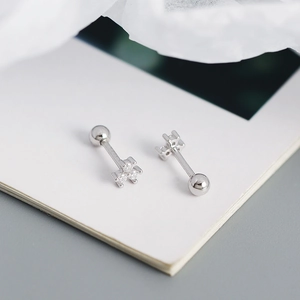 Macro shot of S925 sterling silver mini flower ear studs with three cubic zirconia stones