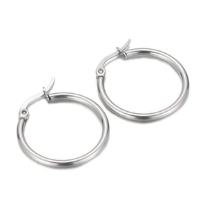 Minimalist polished silver stainless steel large hoop earrings for women on white background