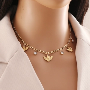 Golden double-layered necklace with angel wing pendants and sparkling zircon accents