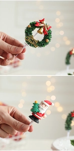Detailed view of Merry Christmas wreath and Santa Claus cake toppers for festive decoration