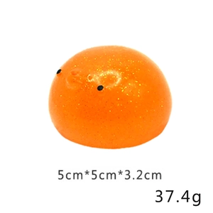 Detailed view of orange glitter squeeze toy measuring 5cm x 5cm and weighing 37.4g