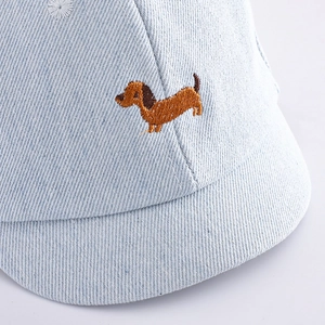 Light blue denim baby baseball cap featuring a detailed brown dachshund puppy embroidery