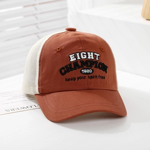 Detailed view of vintage embroidered letters and mesh panel on kids baseball cap
