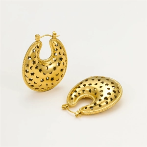 Detail of 18K gold U-shaped hoop earrings with star and moon cutout patterns