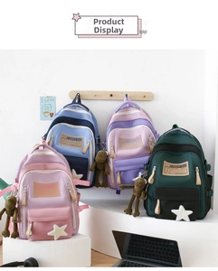 Detailed still life of four nylon backpacks in pastel colors with cute monkey pendants