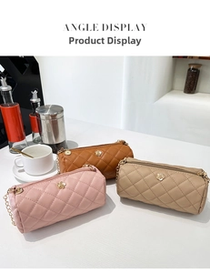 Three elegant cylinder crossbody bags with quilted pattern and gold flower accent