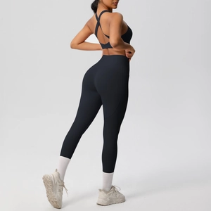 Detail of cross-back yoga bra and high-waist leggings in black brushed fabric