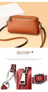Detail of gun-metal hardware and lychee grain leather on crossbody bag with zipper detail