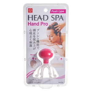 Pink manual scalp massager in transparent packaging for head spa and stress relief