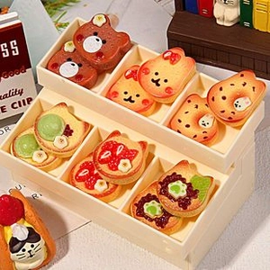 Close-up of a beige double-layer storage box with cute miniature resin food accessories