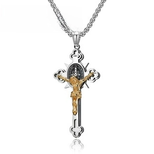 Detailed close-up of a two-tone steel crucifix pendant with golden Jesus and INRI carving