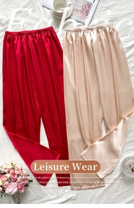 Detail of satin lounge pants showing silky fabric texture and elastic waistband