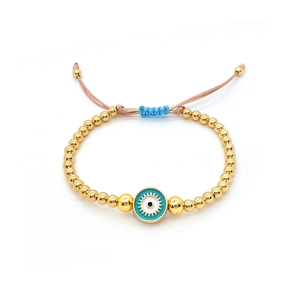 Detailed view of adjustable evil eye bead bracelet with gold accents and woven cord