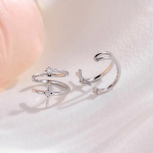 Minimalist silver ear bone clip set with star and cross charms and crystal accents