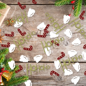 Christmas HoHoHo confetti and candy cane sequins on rustic wood for DIY festive table decor