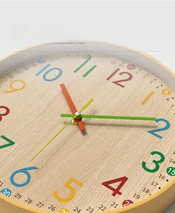 Close-up of bamboo pattern wall clock featuring colorful Arabic numerals and metal hands