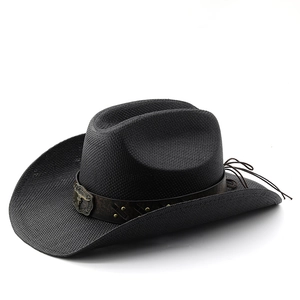 Black straw cowboy hat with vintage leather band and metal bull head emblem