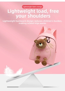 Visual demonstration of the lightweight design with a pink bear backpack on a balance scale