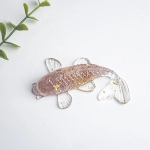 Detailed top view of purple resin koi fish ornament with embedded gold leaf foil flakes
