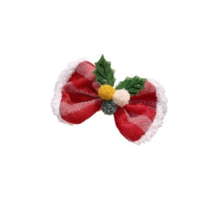 Pince à cheveux de Noël avec nœud rouge pailleté, bords en peluche et détails de feuilles