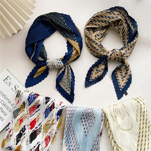 Pleated silk scarves with varied prints like cat and geometric patterns for women