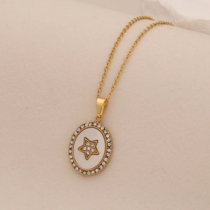 Gold oval pendant necklace with star center and crystal embellishment for women