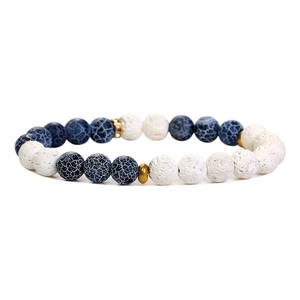 Detail of blue crackle beads and white porous lava rock on a handmade beaded bracelet