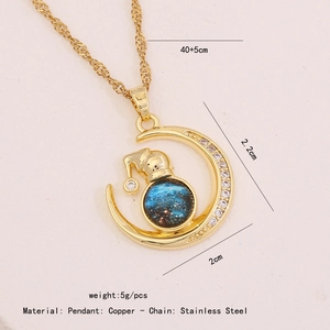 Detailed view of the gold moon and star pendant with chain size and material specs