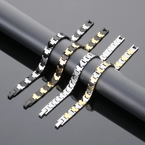 Detailed view of four tungsten steel magnetic bracelets in black, silver, and gold finishes