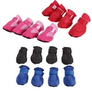 Close-up of breathable mesh dog shoes with adjustable straps and anti-slip soft soles
